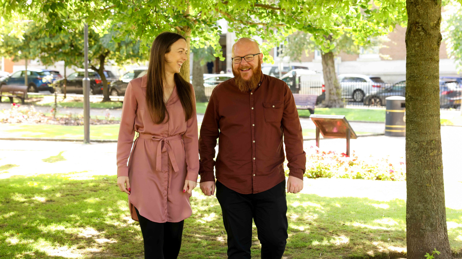 The latest hires at Thrive Law, walking in a park.